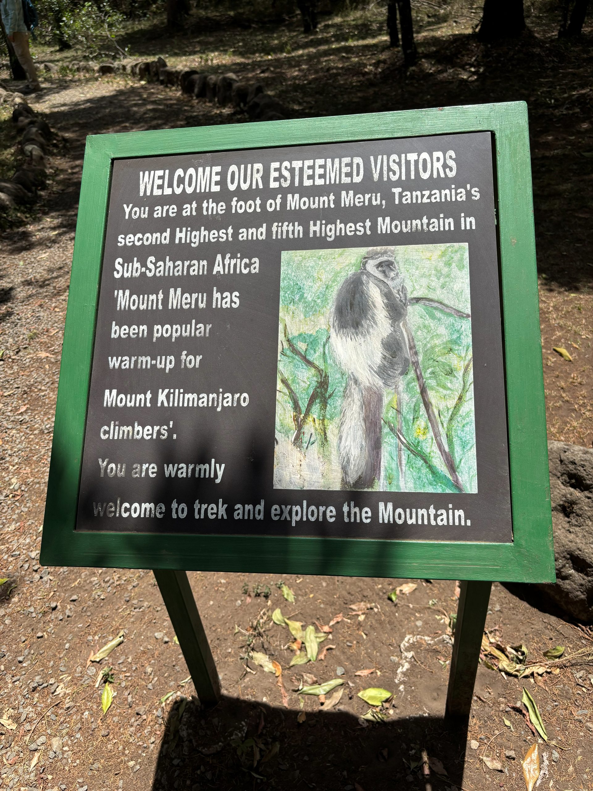 Welcome sign at the foot of Mount Meru